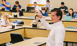 A professor teaching law students in a classroom