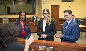 students in a court classroom talking