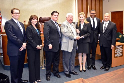 Stetson's winning team of Will Casey,Daniel Miles, Lisa Ungerbuehler and Jean-Pierre Gilbert with competition judges.