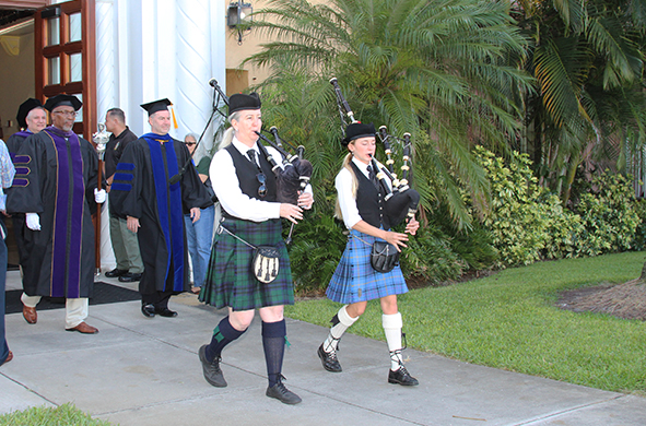 Bagpipers leading a procession into a Stetson Law Spring 2022 commencement ceremony