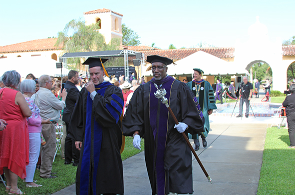 Provost Noel Painter and Assistant Dean Darryl Wilson leaving the courtyard