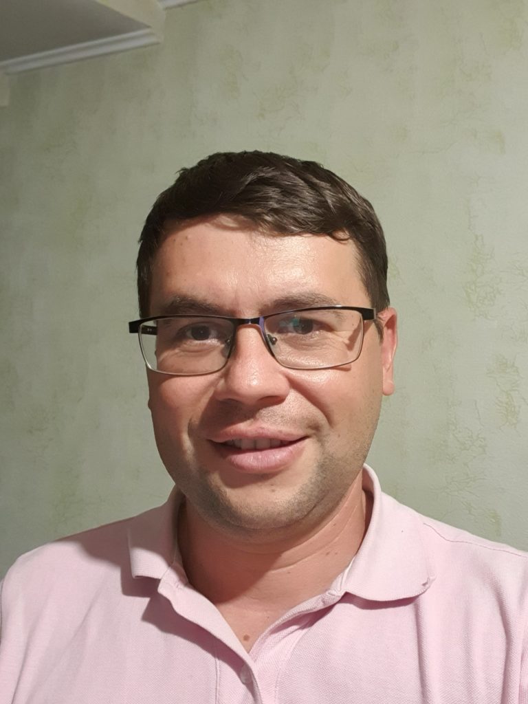 A headshot of Ukrainian legal scholar Dmitriy Kamensky.