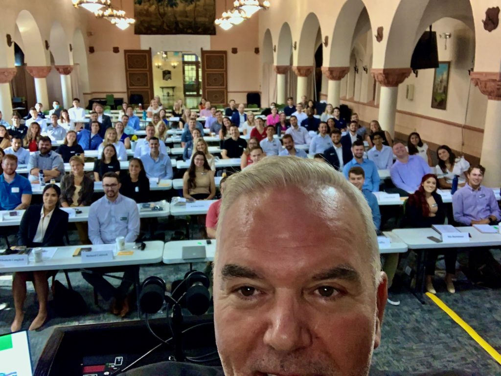 Darren Kettles takes a selfie with a room full of new students in Stetson Law's Great Hall.