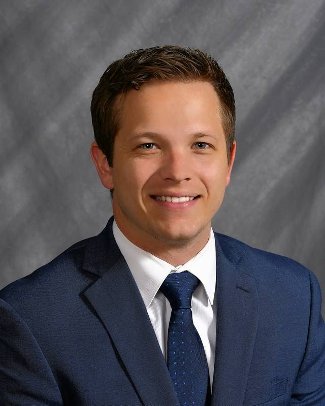 A headshot of Visiting Assistant Professor Mason Clark