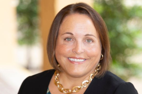 A closeup shot of Law Professor Kirsten K. Davis, who smiles at the camera.