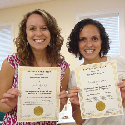 Honorable mention winners Leah Knaap '11 and Nicki Giordano '11 hold honorable mention awards