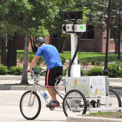 Google Map team member captures imagery while riding trike on the DeLand campus of Stetson University