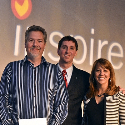 Joel Jones (far left), executive director of Creative Services in SUM, accepted the Grand Award in the category of Green or Sustainable Publications for the VISUAL Admission Magazine, volume ss, edition ss.  Presenting the award to Joel is Awards Chair Joshua Hawkins, from University of Louisville, and CASE president Tina xxxx. 