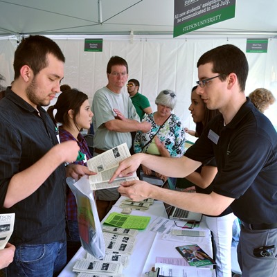 Kevin Winchell, right, helps one of Stetson's admitted students at last year's Hatter Saturday.