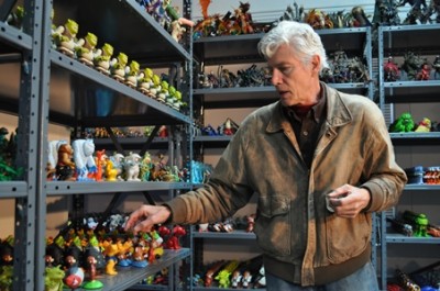 Gunderson with a roomful of toys on shelves