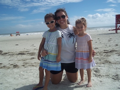 Business major Carleigh Sales and her two sisters help clean up New Smyrna Beach.