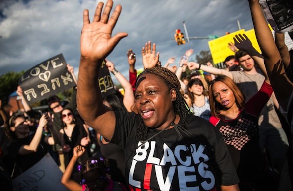 Protesters march in Baltimore, Md. (Photo by Andrew Burton/Getty Images)