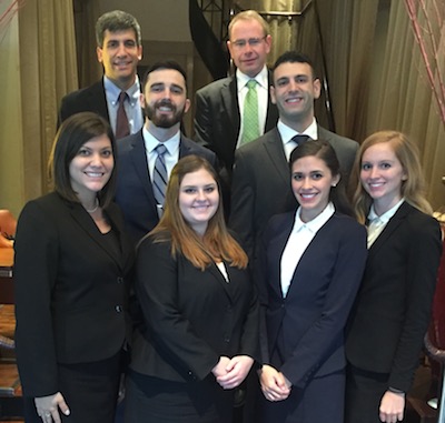 (L-R): Back row: Professor Louis Virelli and Associate Dean Michael Allen (the teams’ coaches); second row: Ryan Hedstrom and Greg Pierson; front row: Natalie Yello, Marissa Cioffi, Anna Kirkpatrick, and Brittany Cover.