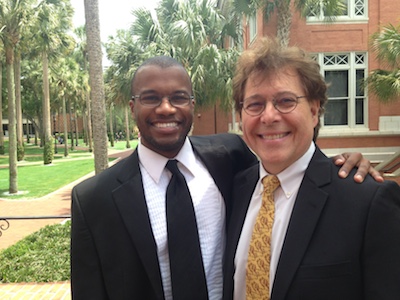 Lyndall Vickers, left, winner of an honorable mention in the Music category, poses with his guitar professor Stephen Robinson.