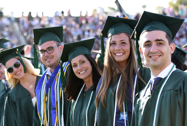 Charles Reyes '16, finance major, far right, is pictured with his fellow business graduates. 