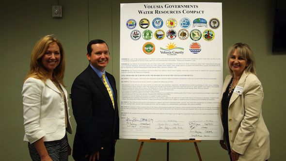 Left to right: State Representative Kristin Jacobs, Matt Surrency, President of the Florida League of Cities, and Deltona City Commissioner and President of the Volusia League of Cities, Heidi Herzberg, with the signed Volusia Governments Water Resources Compact. 
