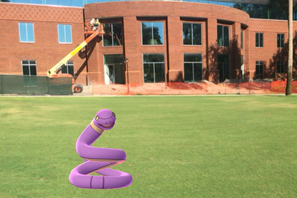A Pokémon Ekans character appears on the lawn in front of the Stetson Welcome Center