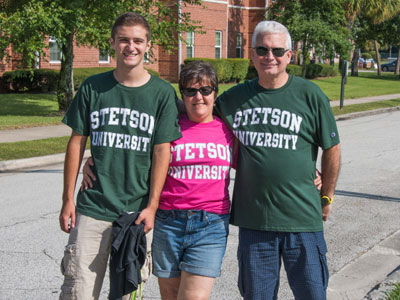 Three people wearing Stetson University t-shirts