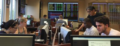 Dr. K.C. Ma in the Roland George Trading Room