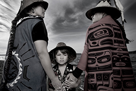 Sisters Darkfeather (left) and Bibianna Ancheta (right), and Eckos Chartraw-Ancheta, members of the Tulalip Tribes
