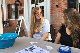 Two Stetson students -- Brooke Fairgrieve and Alyssa Sota, staff a table outside the CUB
