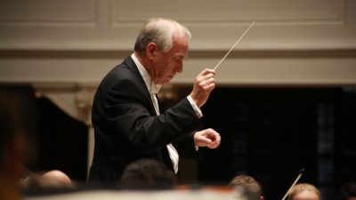 Music Professor Anthony Hose conducting the symphony orchestra