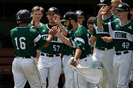 Hatters give high fives during game against Lipscomb