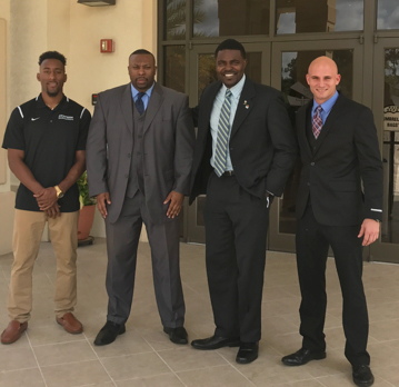Group shot of four alumni and student athletes who spoke at conference