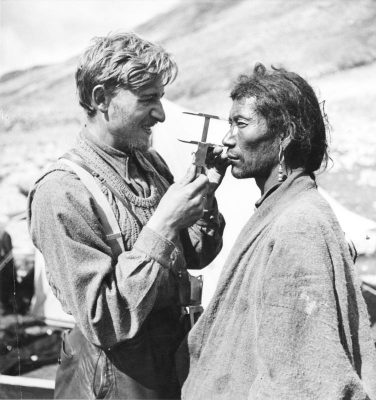 SS scientist uses tool to measure Himalayan man's skull.