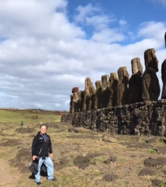 Jeff Altier with carved statues on Easter Island