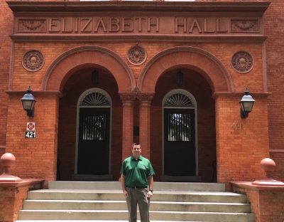 Chris Cloudman in front of Elizabeth Hall