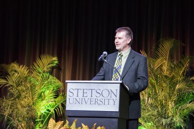 Stetson Executive Vice President and Provost Noel Painter on stage at lecturn