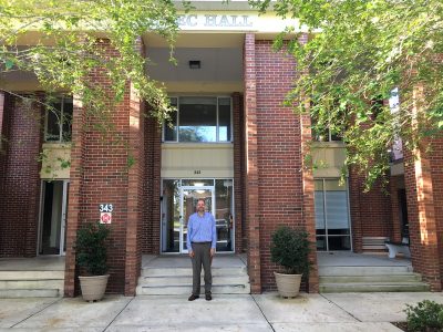 Larry Correll-Hughes stands in front of Nemec Hall