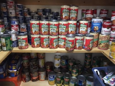 shelves of canned food items in the Hatter Food Pantry