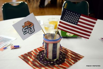Stetson flag and American flag in a little vase on a table at last year's veterans breakfast.