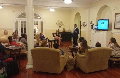 Dr. Rajni Shankar-Brown speaks in a student lounge in the historic dorm to a group of female students.