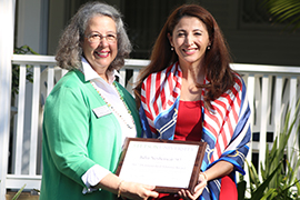 Wendy Libby and Julia Nesheiwat stand side by side holding award