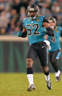 Donald Payne runs down the field during an NFL game