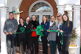 Group shot of Stetson President Wendy Libby and other college officials cutting a green ribbon for grand opening of Griffith Hall
