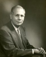 posed portrait of president J. Ollie Edmunds in a suit
