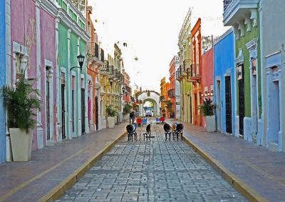 Street scene in Campeche, Mexico, will buildings brightly painted in colorful pastel colors.