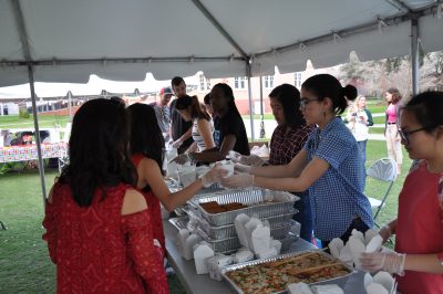 Stetson students enjoy Asian food at the celebration, in line at buffet.