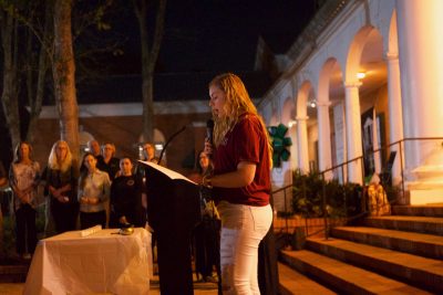 Aviva Edrich stands on the stairs of the CUB addressing students at the vigil