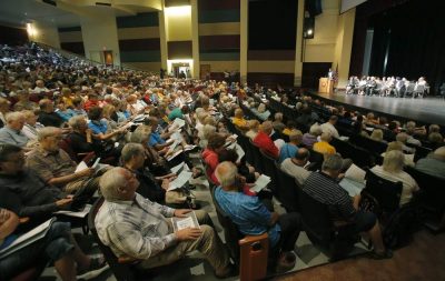 big crowd shot in an auditorium of FAITH meeting