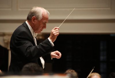Anthony Hose conducts an orchestra