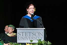 Megan O’Neill at podium during Convocation