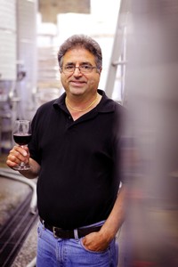 Steve DiFrancesco holds a glass of wine