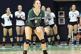 Chelcie Spence stands poised for play on the volleyball court