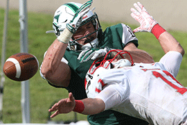 A Hatter player breaks up a throw to Marist player