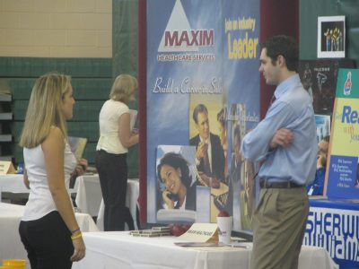 file shot of a student talking to an employer at a Stetson job fair.
